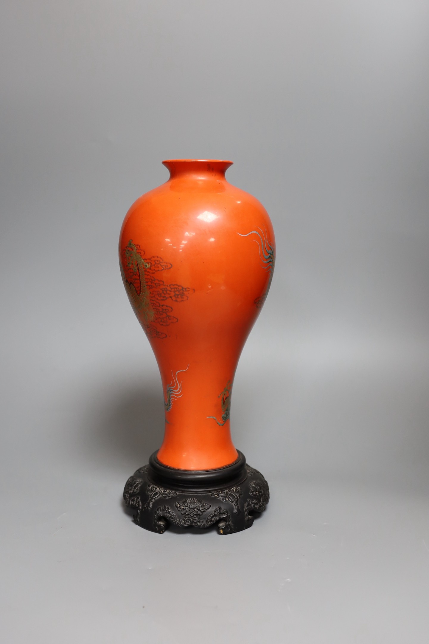 A large Chinese Fuzhou lacquer red 'dragon' vase, dated 1956, 33.5cm tall